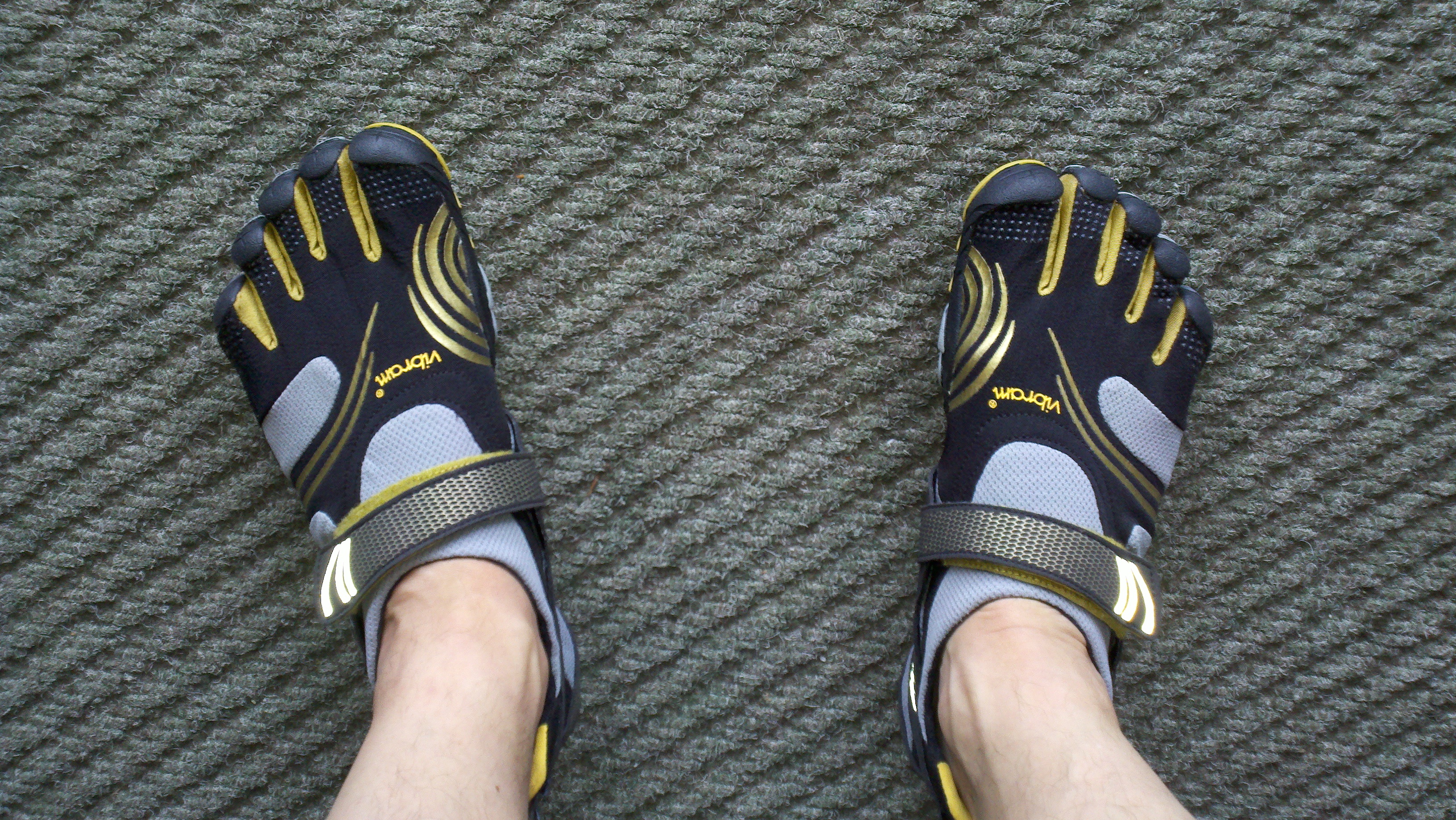 Feet wearing Vibrams Fivefingers